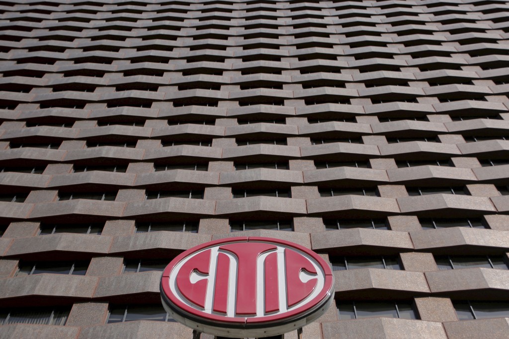 A CITIC Securities logo is seen at a building where its branch is located in Beijing, China, March 23, 2016.   REUTERS