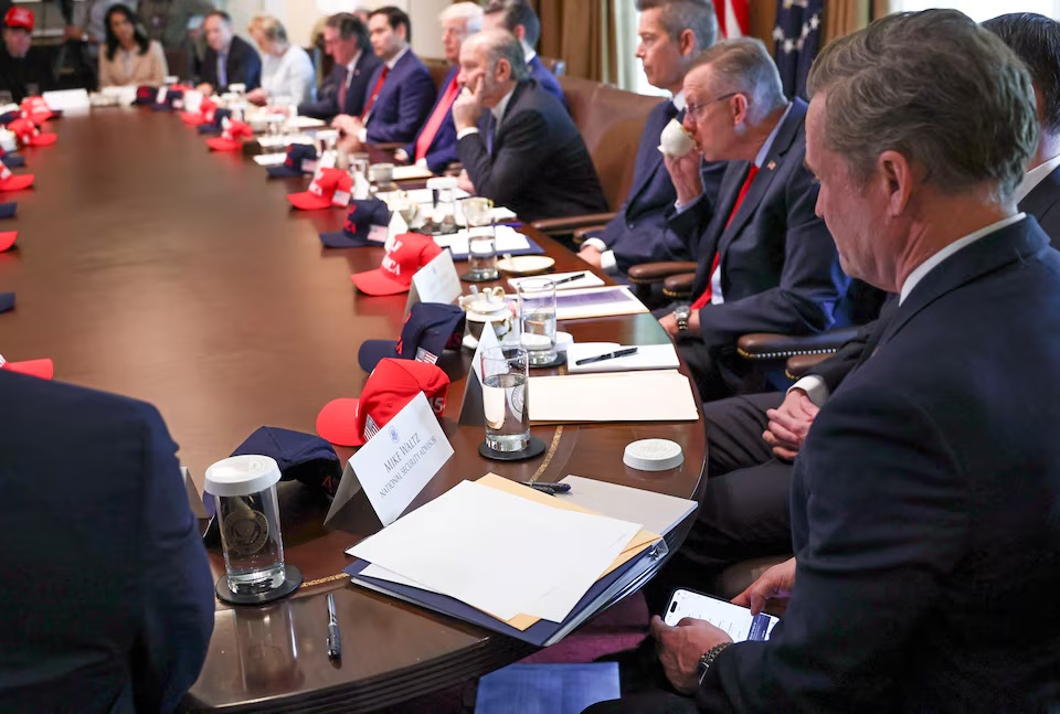 U.S. National Security Advisor Mike Waltz checks his mobile phone while attending a cabinet meeting held by U.S. President Donald Trump at the White House in Washington, D.C., U.S., April 30, 2025. REUTERS/Evelyn Hockstein TPX IMAGES OF THE DAY 