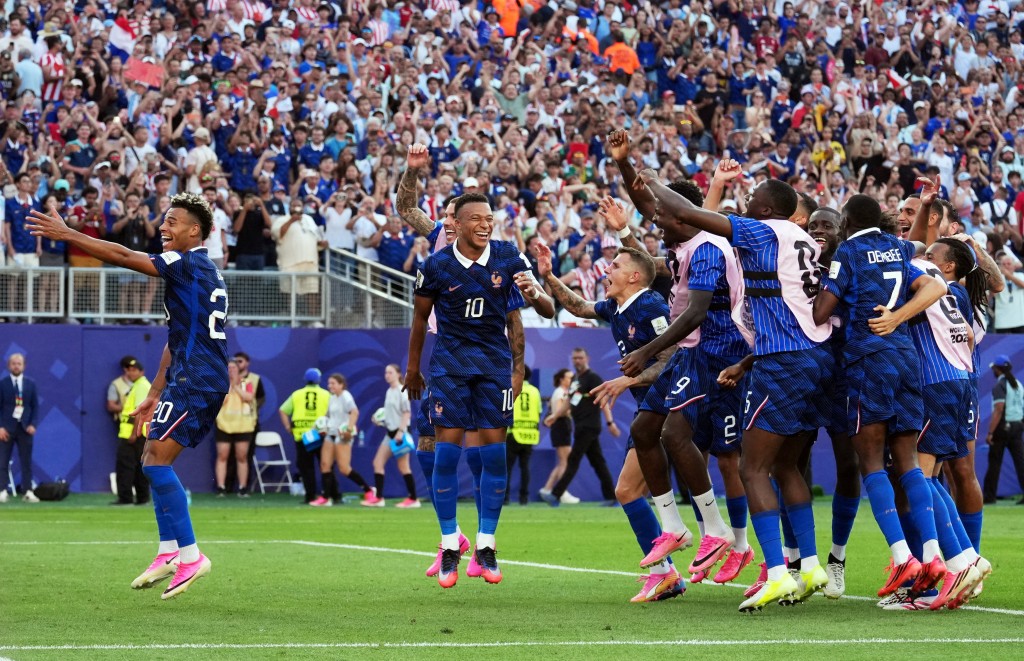 France's Desire Doue, Kylian Mbappe and teammates celebrate after the match (Reuters)