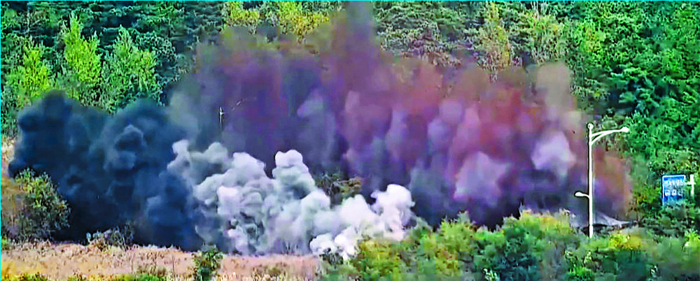 A huge explosion on a road connecting North and South Korea is caught on video, prompting South Korea's military to fire warning shots. AFP A huge explosion on a road connecting North and South Korea is caught on video, prompting South Korea's military to fire warning shots. AFP