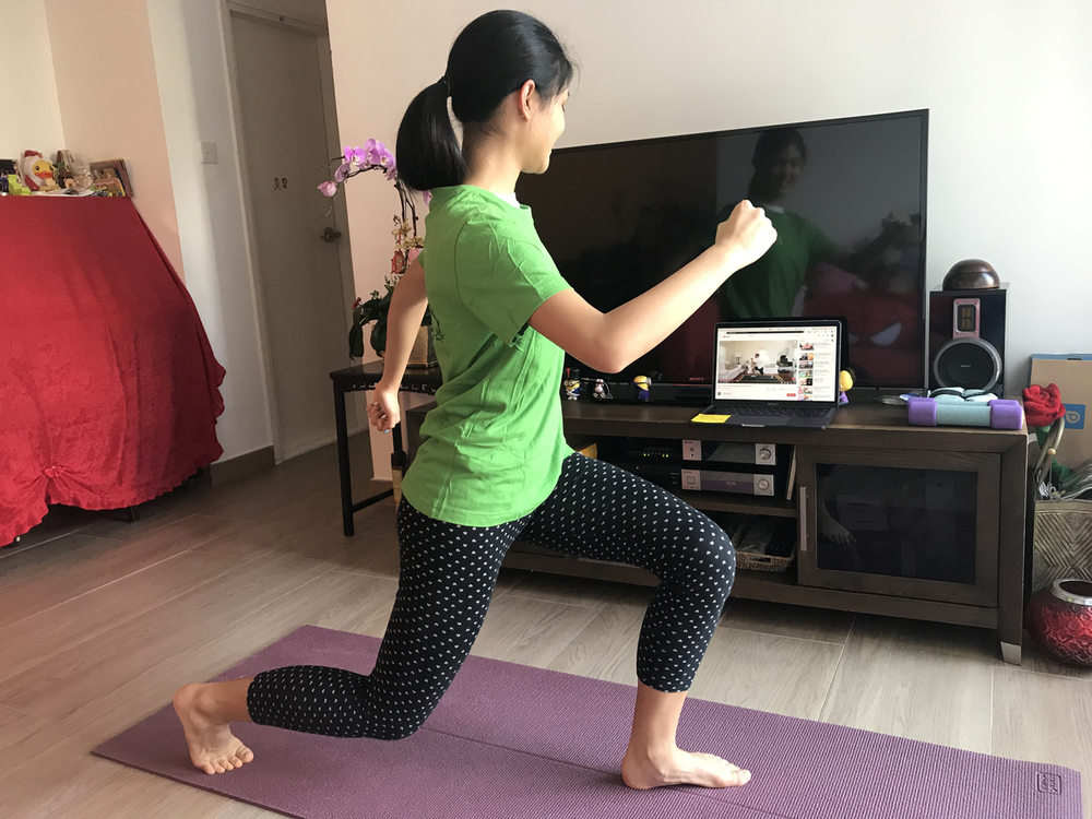 A Secondary student attends a PE lesson while interacting with her classmates virtually. A Secondary student attends a PE lesson while interacting with her classmates virtually.