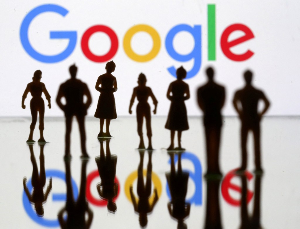Small toy figures are seen in front of Google logo in this illustration picture, April 8, 2019. REUTERS
