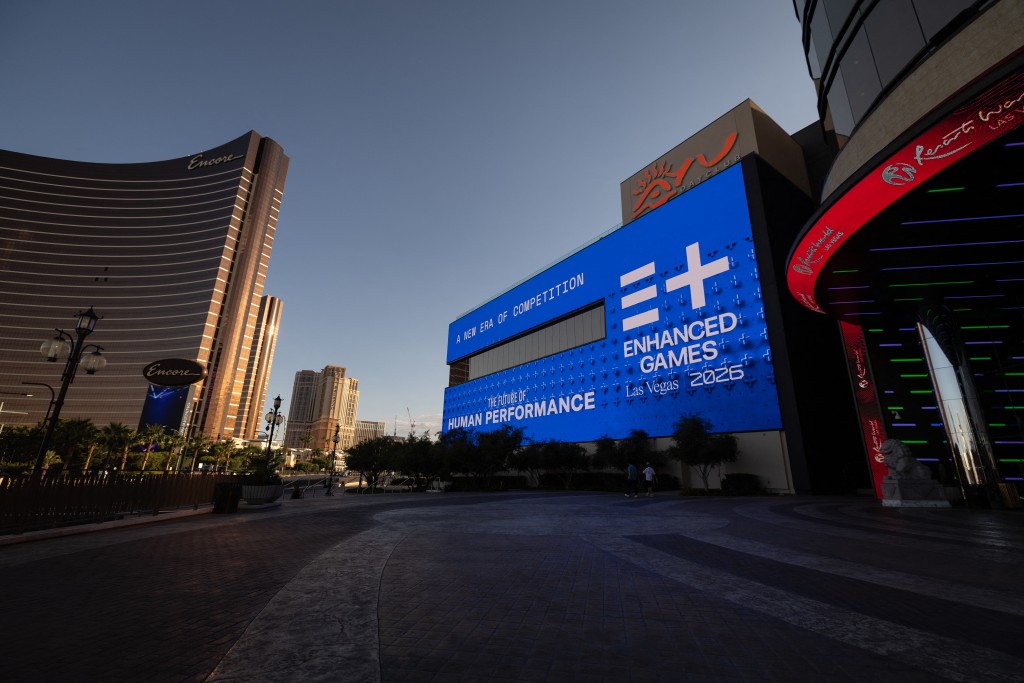 Photo by ETIENNE LAURENT / AFP. Large screens on the Resorts World display advertisement for the Enhanced Games ahead of the event in Las Vegas, Nevada, on May 22, 2026.