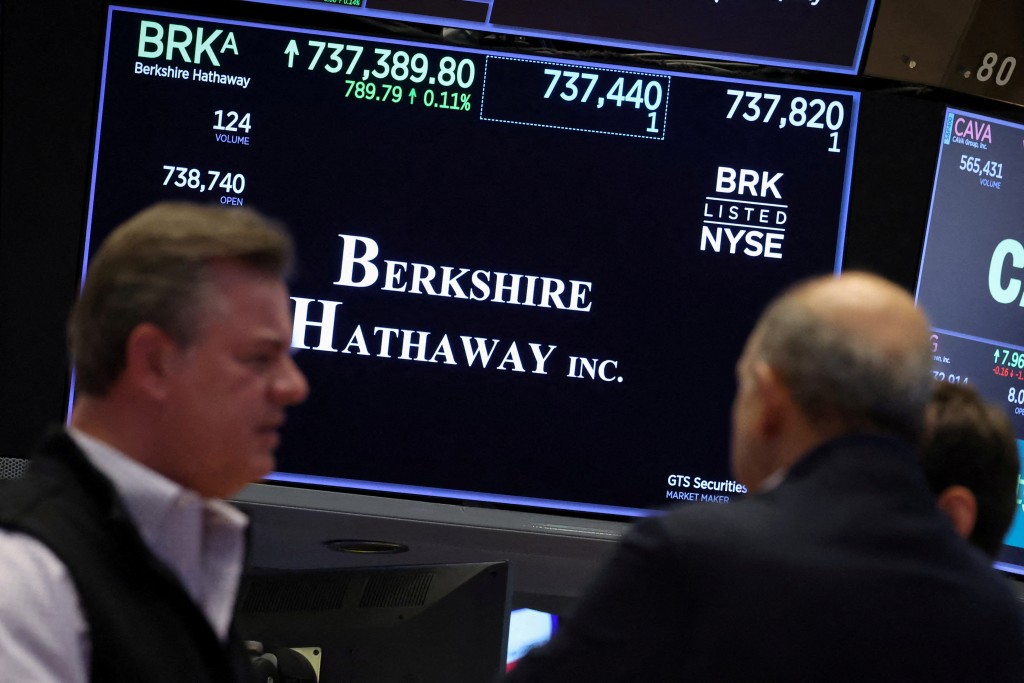 A screen displays the trading information for Berkshire Hathaway inc. as traders work on the floor at the New York Stock Exchange (NYSE) in New York City, U.S., October 22, 2025.  REUTERS/Brendan McDermid