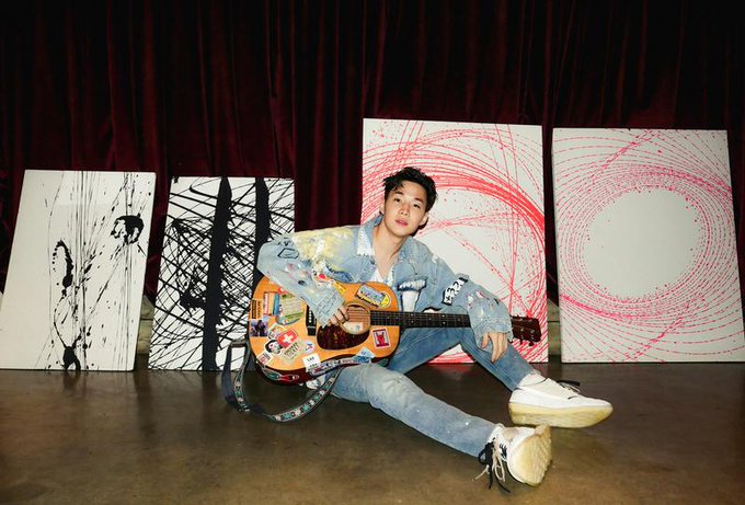 Henry Lau poses with his artworks, from left, titled 'Northern Spashes,' 'Invigorate,' 'Starry,' and 'Forever' in his studio in Seoul, South Korea March 2021. Henry Lau poses with his artworks, from left, titled 'Northern Spashes,' 'Invigorate,' 'Starry,' and 'Forever' in his studio in Seoul, South Korea March 2021.