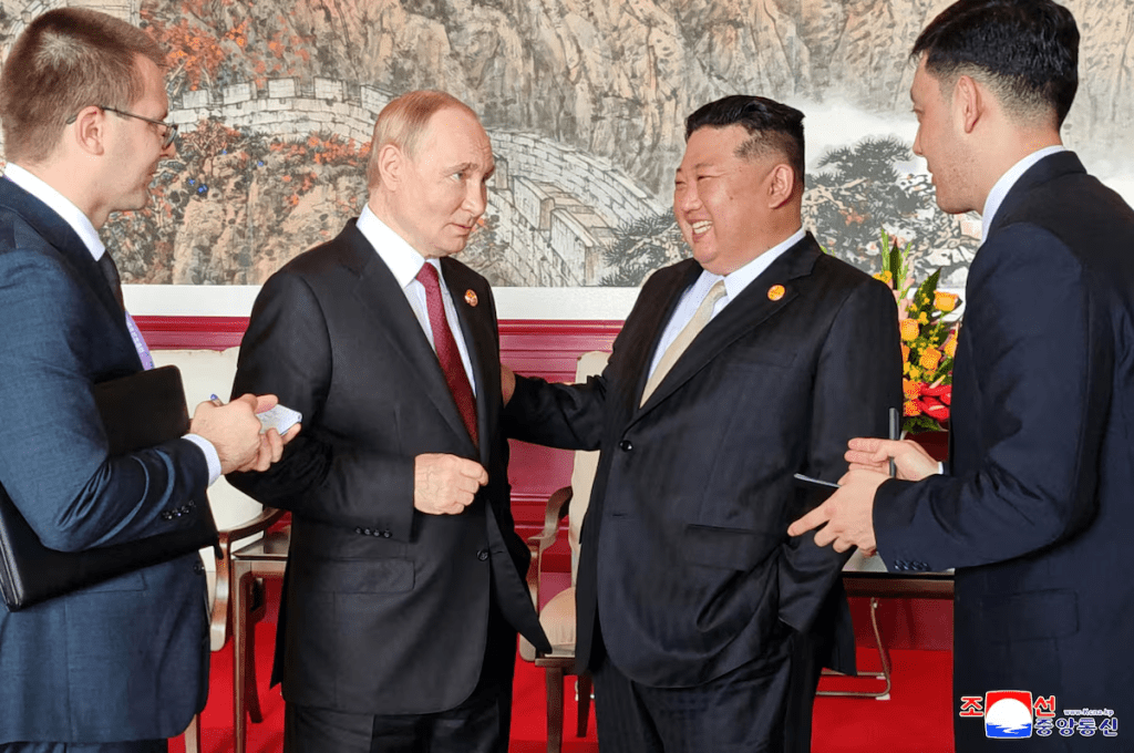 North Korean leader Kim Jong Un speaks with Russian President Vladimir Putin during their visit to Beijing to attend China's commemoration of the 80th anniversary of the end of World War Two, in Beijing, China, September 3, 2025, in this picture released by the Korean Central News Agency. KCNA via REUTERS