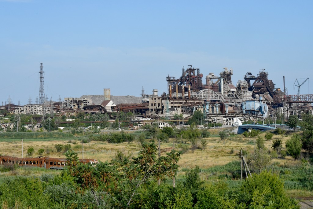 (FILES) A picture shows the destroyed Azovstal steel plant in the Russian-controlled Azov Sea port city of Mariupol in southeastern Ukraine on July 14, 2025, amid the ongoing Russian-Ukrainian conflict. (Photo by Olga MALTSEVA / AFP)