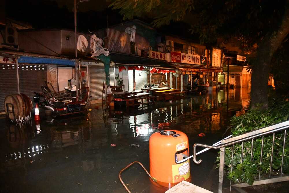 In the village of Sam Ka Tsuen in Lei Yue Mun, villagers waded through knee-high water.