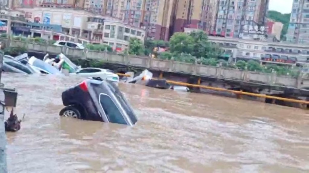  Cars partially submerged in floodwaters after heavy rainfall in Duyun, Guizhou Province, China, May 19, 2026, in this still image obtained from a social media video. Social Media/via REUTERS 