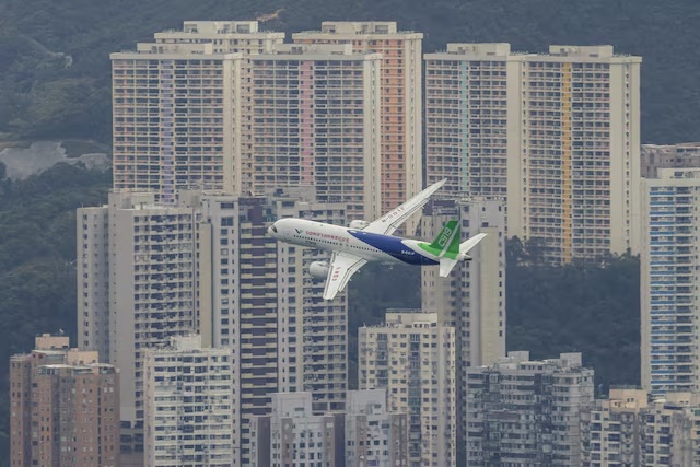 China's first domestically manufactured passenger aircraft Comac C919 flies over Victoria Harbour during its inaugural voyage outside the mainland, in Hong Kong, China December 16, 2023. REUTERS/Tyrone Siu/File Photo China's first domestically manufactured passenger aircraft Comac C919 flies over Victoria Harbour during its inaugural voyage outside the mainland, in Hong Kong, China December 16, 2023. REUTERS/Tyrone Siu/File Photo