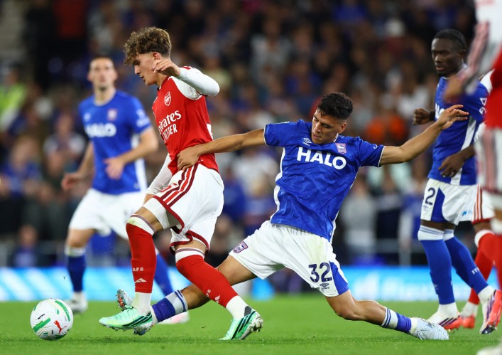 Max Dowman is tackled by Marcelino Nunez of Ipswich during the third-round match. REUTERS