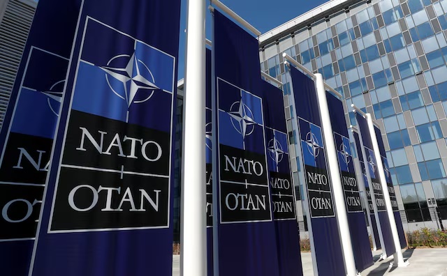 Banners displaying the NATO logo are placed at the entrance of new NATO headquarters during the move to the new building, in Brussels, Belgium April 19, 2018. REUTERS/Yves Herman/File Photo