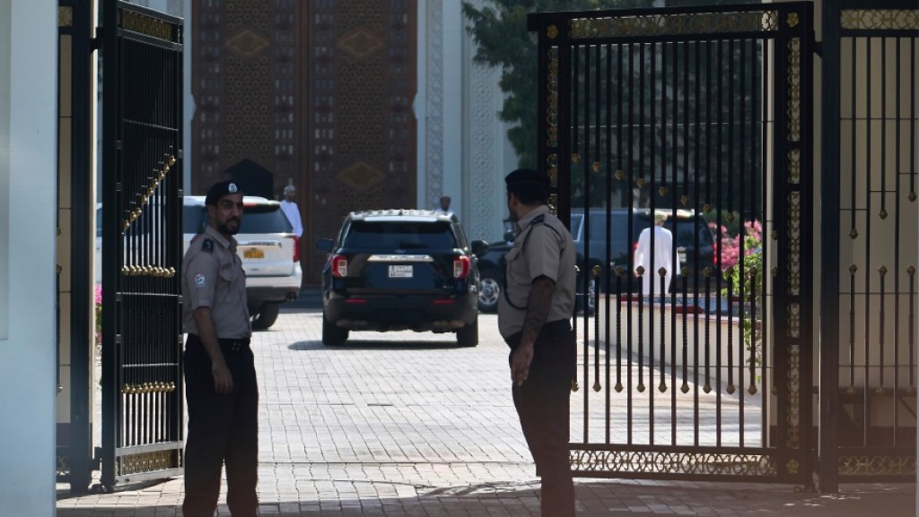 Omani security personnel watch a convoy believed to be carrying U.S. Mideast envoy Steve Witkoff in Muscat, Oman, Saturday, April 12, 2025. (AP Photo/Fatima Shbair)