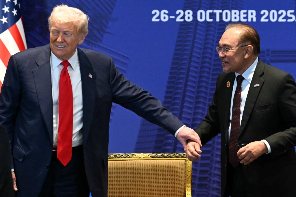 U.S. President Donald Trump gestures to Malaysia's Prime Minister Anwar Ibrahim during a meeting on the sidelines of the 47th Association of Southeast Asian Nations (ASEAN) Summit in Kuala Lumpur, Malaysia, October 26, 2025. (Reuters)