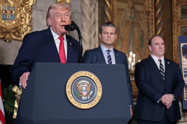 U.S. President Donald Trump makes an announcement about the Navy's "Golden Fleet", as Secretary of Defense Pete Hegseth and Secretary of the Navy John Phelan listen, at Mar-a-lago in Palm Beach, Florida, U.S., December 22, 2025. REUTERS/Jessica Koscielniak 