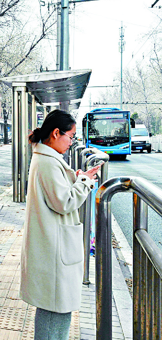 A young woman spends time with Rafayel, a virtual character in the mobile game Love and Deepspace, while studying, eating and waiting for a bus. AFP