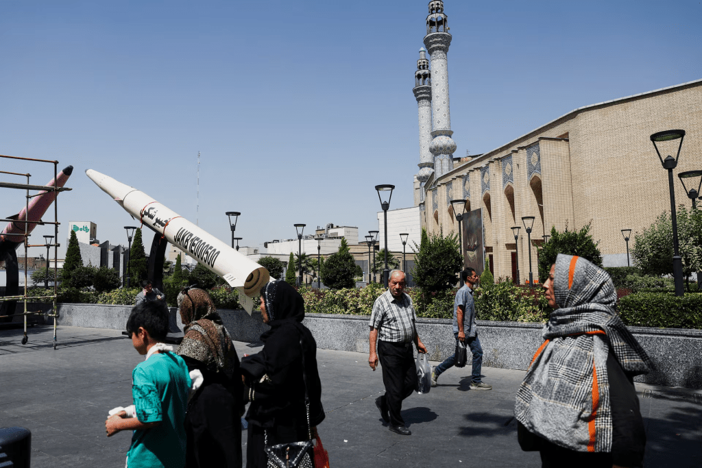 People walk next to a symbolic mock-up of an Iranian missile, on a street in Tehran, Iran, June 11, 2026. Majid Asgaripour/WANA (West Asia News Agency) via REUTERS