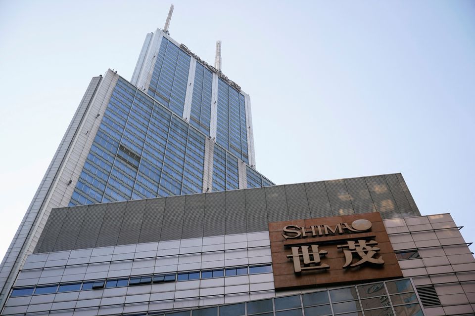 The logo of property developer Shimao Group is seen on the facade of Shimao International Plaza in Shanghai, China. (Reuters)