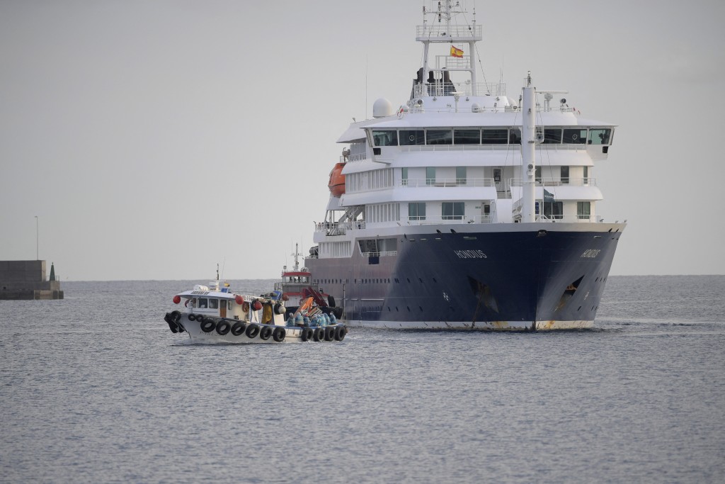 US passengers from the Dutch flagged hantavirus-stricken cruise ship MV Hondius are transferred by boat to the industrial port of Granadilla de Abona on the island of Tenerife in Spain's Canary Islands on May 10, 2026. (AFP)