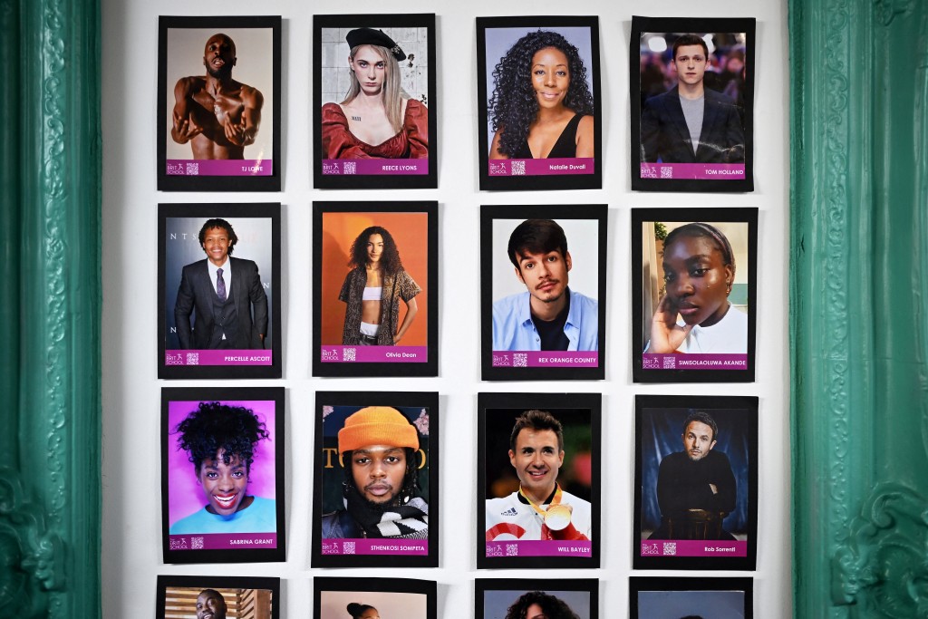 Photo by JUSTIN TALLIS / AFP  The "Brit" wall of fame is pictured at The BRIT School in Croydon, south London, on April 14, 2026.