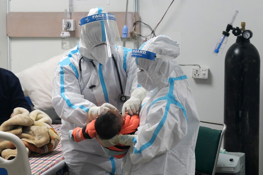 A baby is attended to at a Covid treatment facility in New Delhi. BLOOMBERG A baby is attended to at a Covid treatment facility in New Delhi. BLOOMBERG