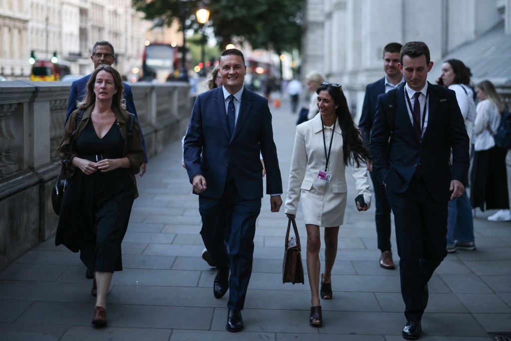 Photo by HENRY NICHOLLS / AFP Britain's former health secretary Wes Streeting (2nd L) arrives at Downing Street in London on July 20, 2026, as cabinet appointments are being made after Andy Burnham became Britain's new prime minister.