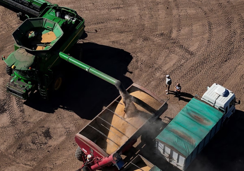 A drone view shows a harvesters working in a soybean plantation in San Andres de Giles, on the outskirts of Buenos Aires, Argentina, May 12, 2025. REUTERS