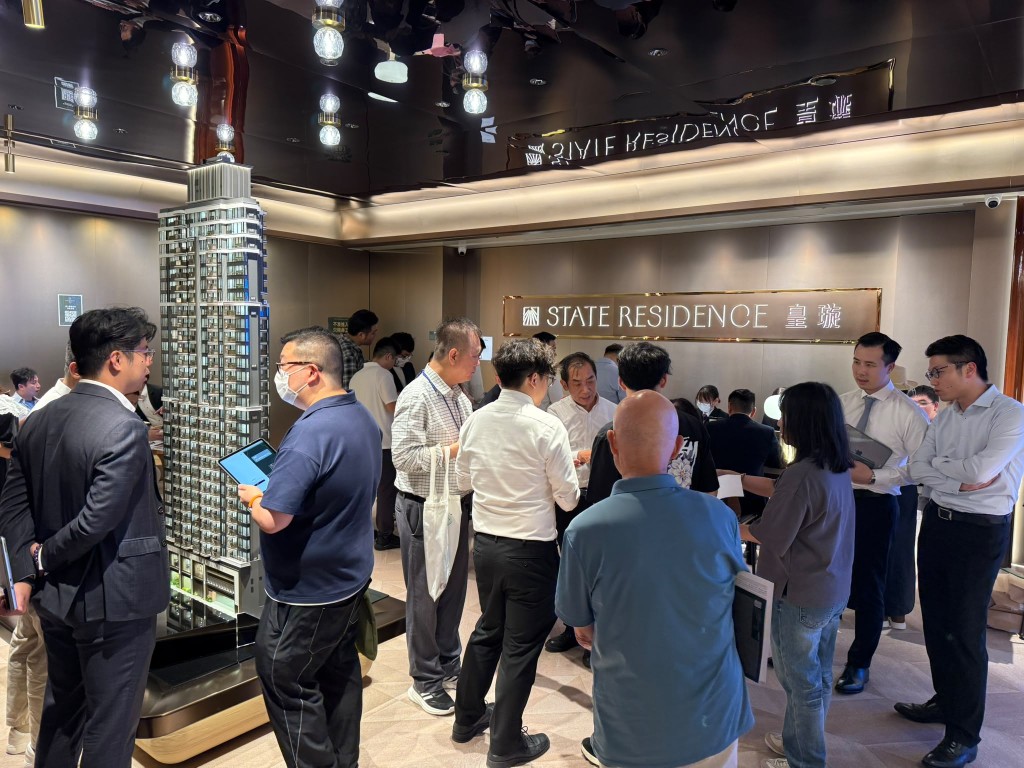 People line up to visit the project.