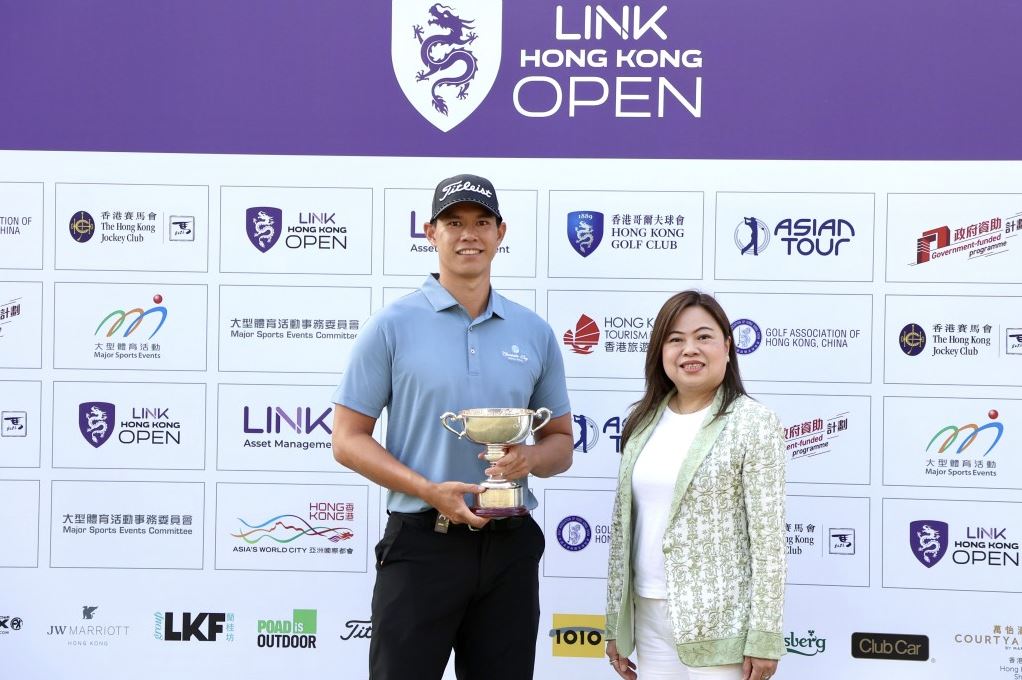 Rosanna Law, right, presents the trophy to Matthew Cheung.