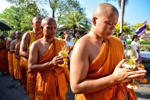 Reverence for the saffron-robed Buddhist monkhood is deeply woven into Thai society, but a sex extortion scandal has besmirched the clergy and left the devout questioning their faith. (AFP)