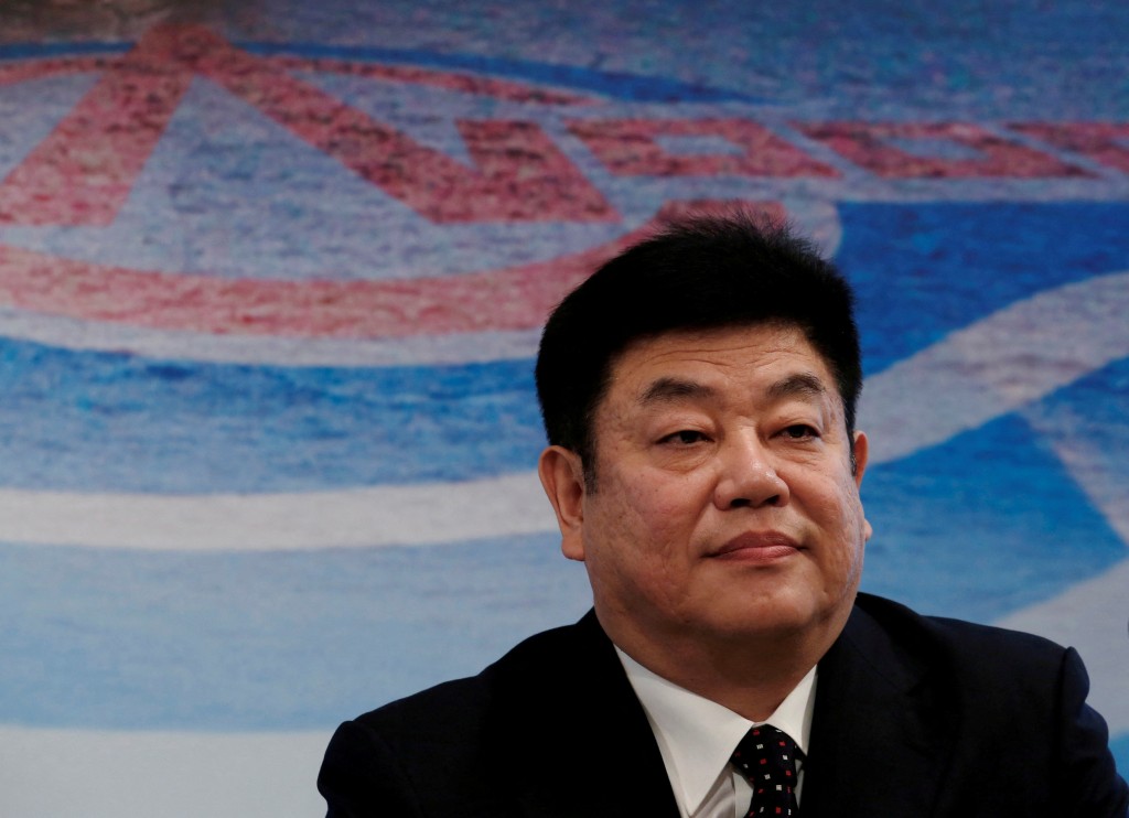 Yuan Guangyu attends a news conference on the company's interim results in Hong Kong, China August 24, 2016. REUTERS/Bobby Yip