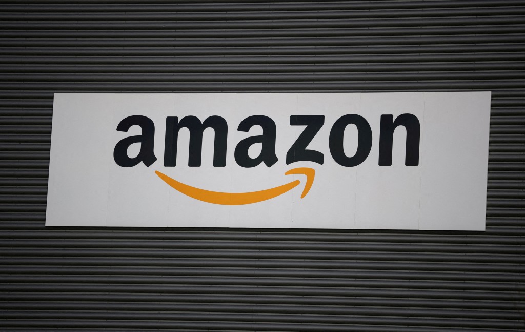 Amazon logo outside an Amazon warehouse in Manchester, Britain, October 28, 2025. REUTERS