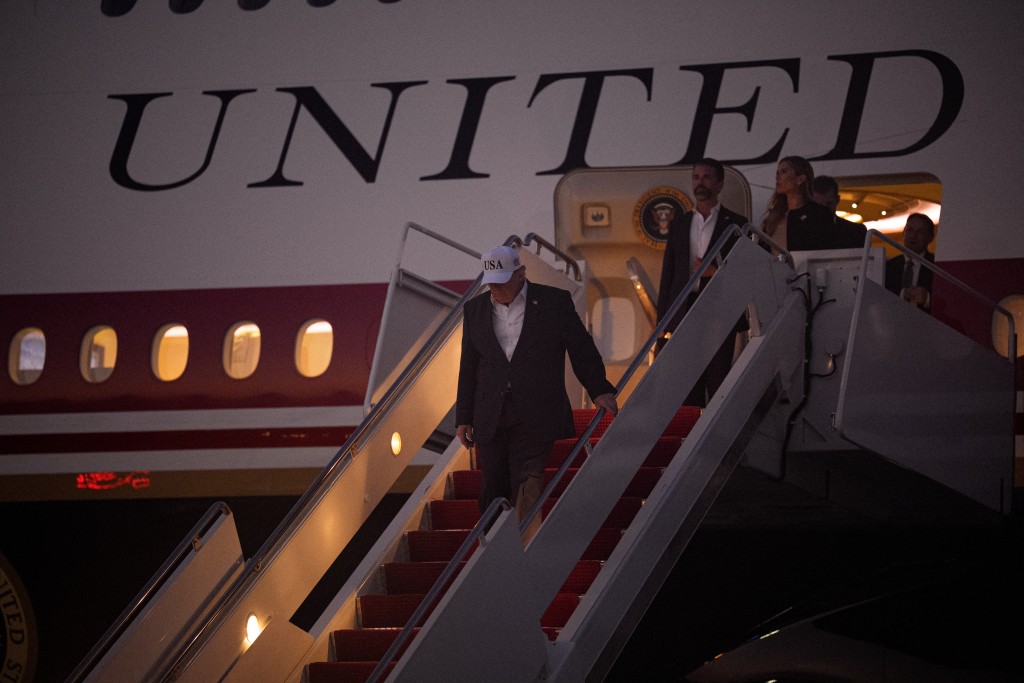 U.S. President Donald Trump (L), accompanied by Donald Trump Jr. (2nd-R) and his wife Bettina Anderson (R), arrives on July 01, 2026 at Joint Base Andrews, Maryland. Trump is returning from North Dakota after attending the Theodore Roosevelt Presidential Library dedication on his first trip using the new Air Force One aircraft gifted to the U.S. by Qatar's government. Andrew Harnik/Getty Images/AFP