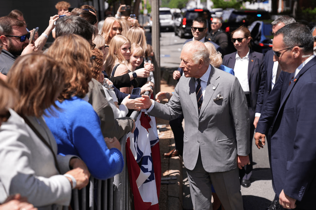Britain's King Charles and Queen Camilla greet people during a parade in Front Royal, Virginia, U.S., April 30, 2026. Matt Rourke/Pool via REUTERS