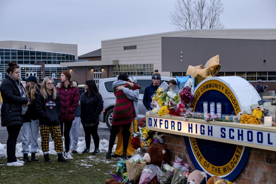 Students pay their respects at a memorial at Oxford High School a day after the year's deadliest U.S. school shooting which killed and injured several people, in Oxford, Michigan. (Reuters) Students pay their respects at a memorial at Oxford High School a day after the year's deadliest U.S. school shooting which killed and injured several people, in Oxford, Michigan. (Reuters)