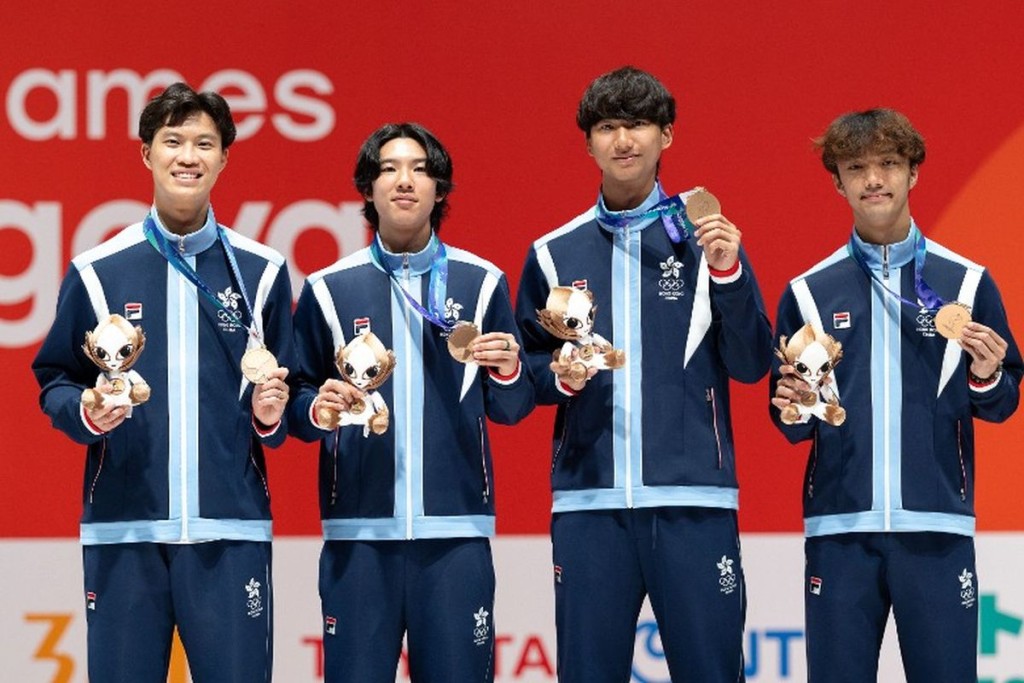 Owen Leung Tin-ching (third from left), a Year 6 student in Physical Education, Exercise Science and Health and a SALSA student, helps the Hong Kong team win bronze in the men’s team sabre