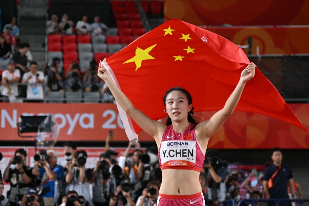 China's Chen Yujie celebrates after winning the women's 100m final during the 2026 Asian Games at Nagoya City Mizuho Park Athletic Stadium in Nagoya, Aichi Prefecture on September 25, 2026. (Photo by MOHD RASFAN / AFP)