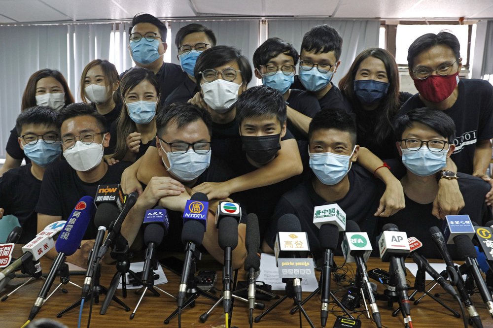 Pro-democracy activists who were elected from unofficial pro-democracy primaries, including Joshua Wong, left, at a press conference on July 15, 2020.