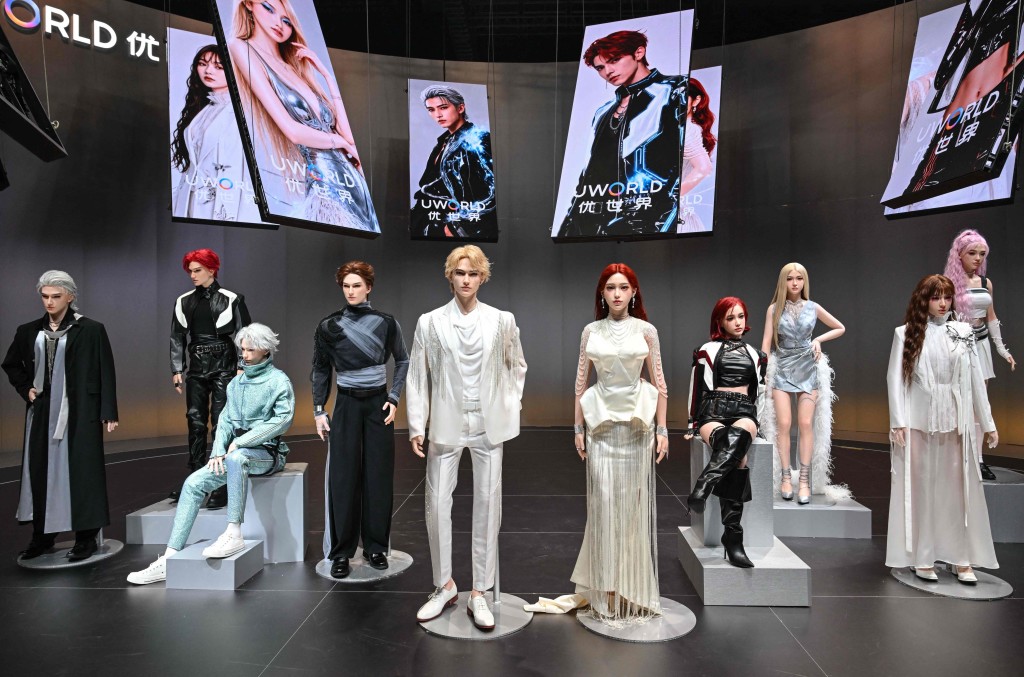 Humanoid robots are displayed during the launch of the U1 humanoid robot produced by UWORLD. ADEK BERRY / AFP