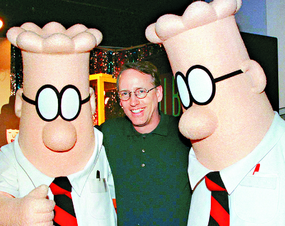 A 1999 picture of Scott Adams with two Dilbert characters. REUTERS A 1999 picture of Scott Adams with two Dilbert characters. REUTERS