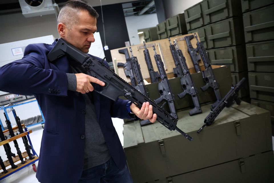 Michal Kowalczyk, 42 director of production, presents GROT C16 FB-M1, modular assault rifle system at PGZ (Polska Grupa Zbrojna) arms factory Fabryka Broni Lucznik in Radom, Poland. (Reuters) 