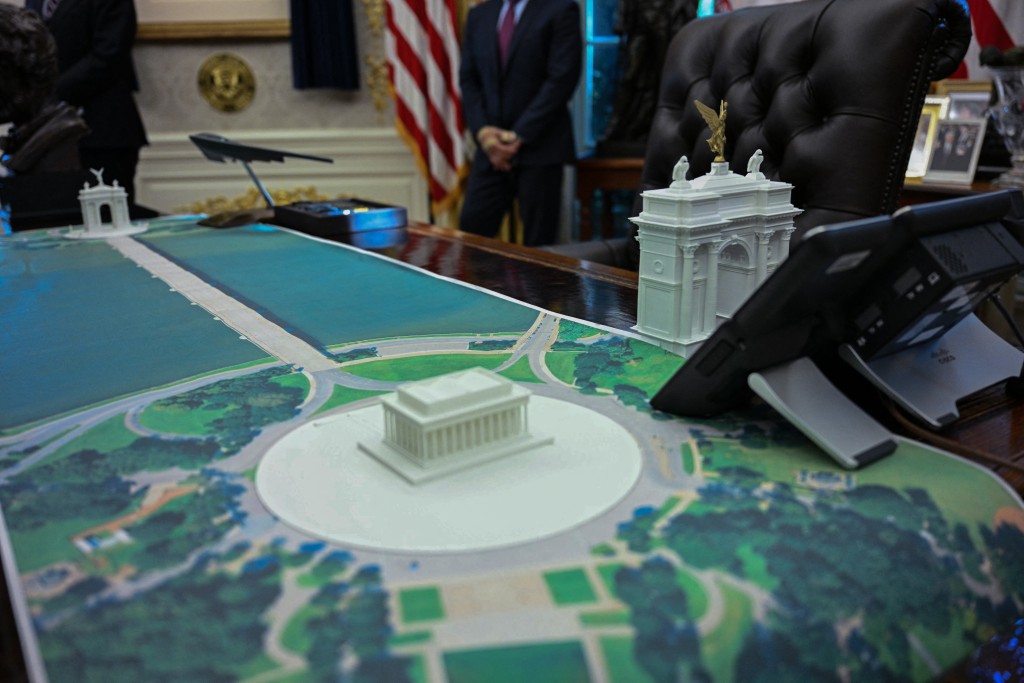 A plan for an arch across from the Lincoln Memorial is seen on the Resolute Desk as US President Donald Trump meets with Finnish President Alexander Stubb and Prime Minister Petteri Orpo in the Oval Office of the White House in Washington, DC, on October 9, 2025. (Photo by Jim WATSON / AFP)