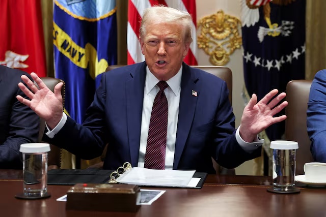 U.S. President Donald Trump gestures during a cabinet meeting at the White House in Washington, D.C., U.S., August 26, 2025. REUTERS/Jonathan Ernst/File photo