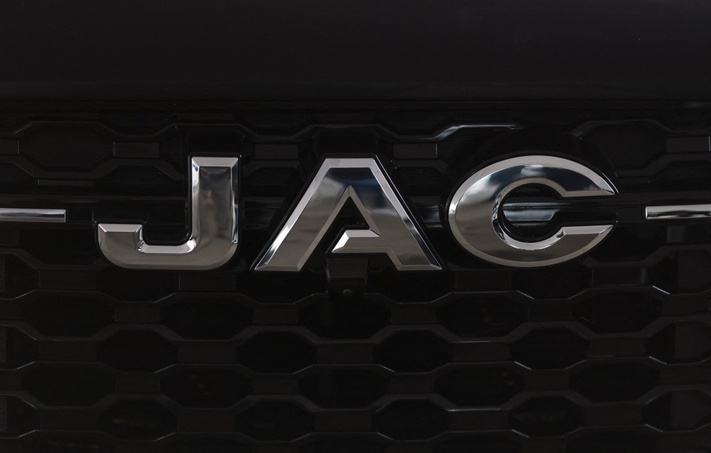 The JAC logo is seen on a displayed pickup truck during a media tour at the Chinese automaker JAC Motors plant in Ciudad Sahagun