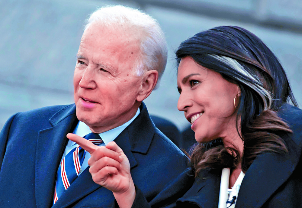 Tulsi Gabbard hobnobbing with fellow Democratic Party candidate and eventual President Joe Biden back in 2020. REUTERS Tulsi Gabbard hobnobbing with fellow Democratic Party candidate and eventual President Joe Biden back in 2020. REUTERS