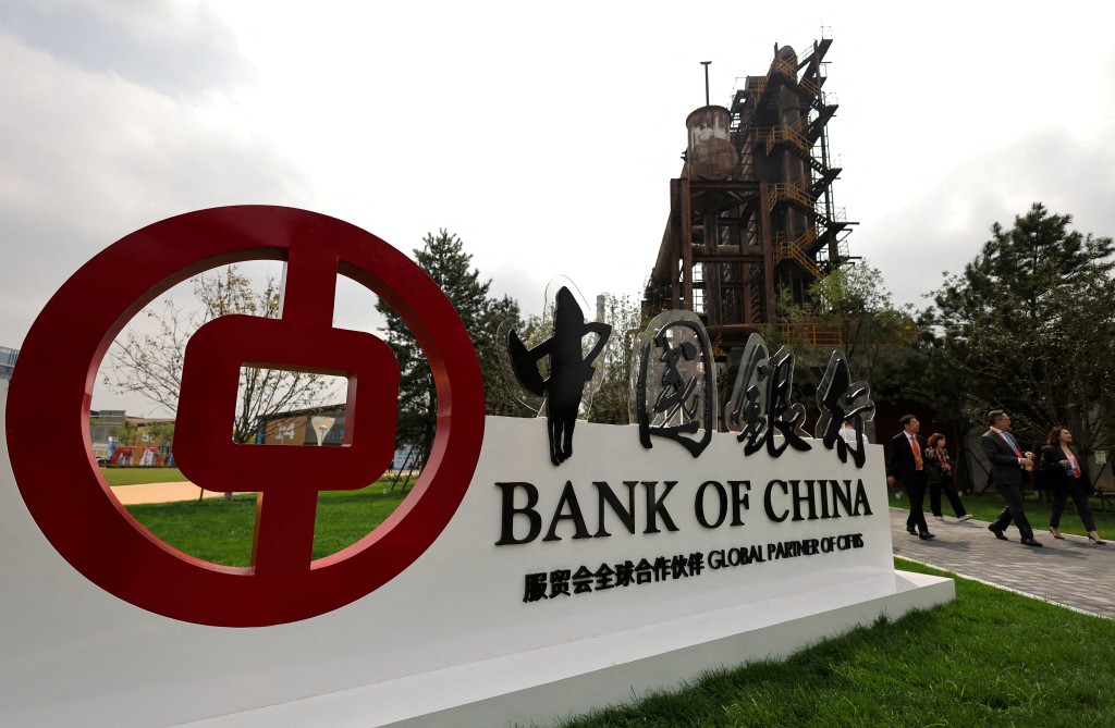 People walk next to a logo of the Bank of China at China International Fair for Trade in Services (CIFTIS) venue at Shougang Park in Beijing, China, September 10, 2025. REUTERS
