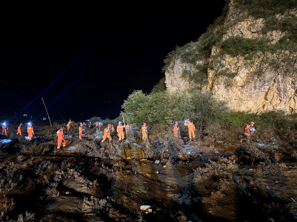 Rescue workers carry out search and rescue operations following flash floods at a scenic area in Weiyuan county, Dingxi city, Gansu province. (Reuters)