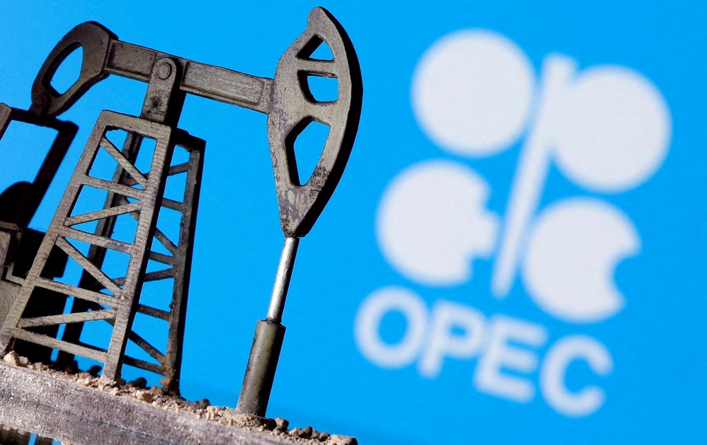 A 3D printed oil pump jack is seen in front of displayed OPEC logo in this illustration picture, April 14, 2020. REUTERS/Dado Ruvic/Illustration
