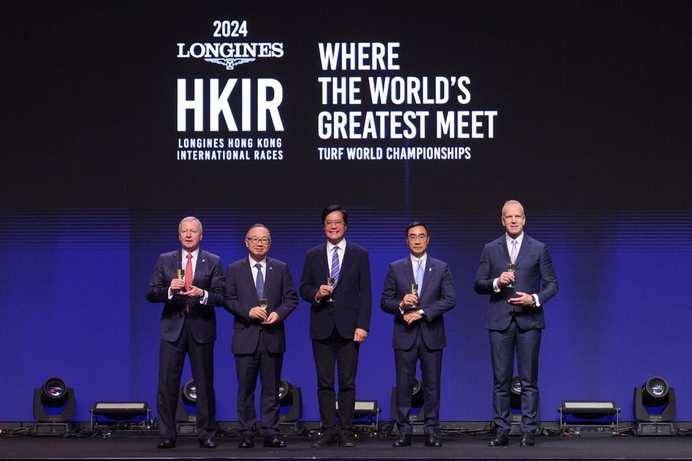 Officiating guests toast success on stage at the LONGINES Hong Kong International Races Gala Dinner.