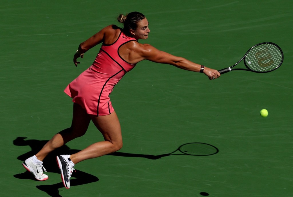 Aryna Sabalenka stretches for a ball while playing Naomi Osaka. AFP 